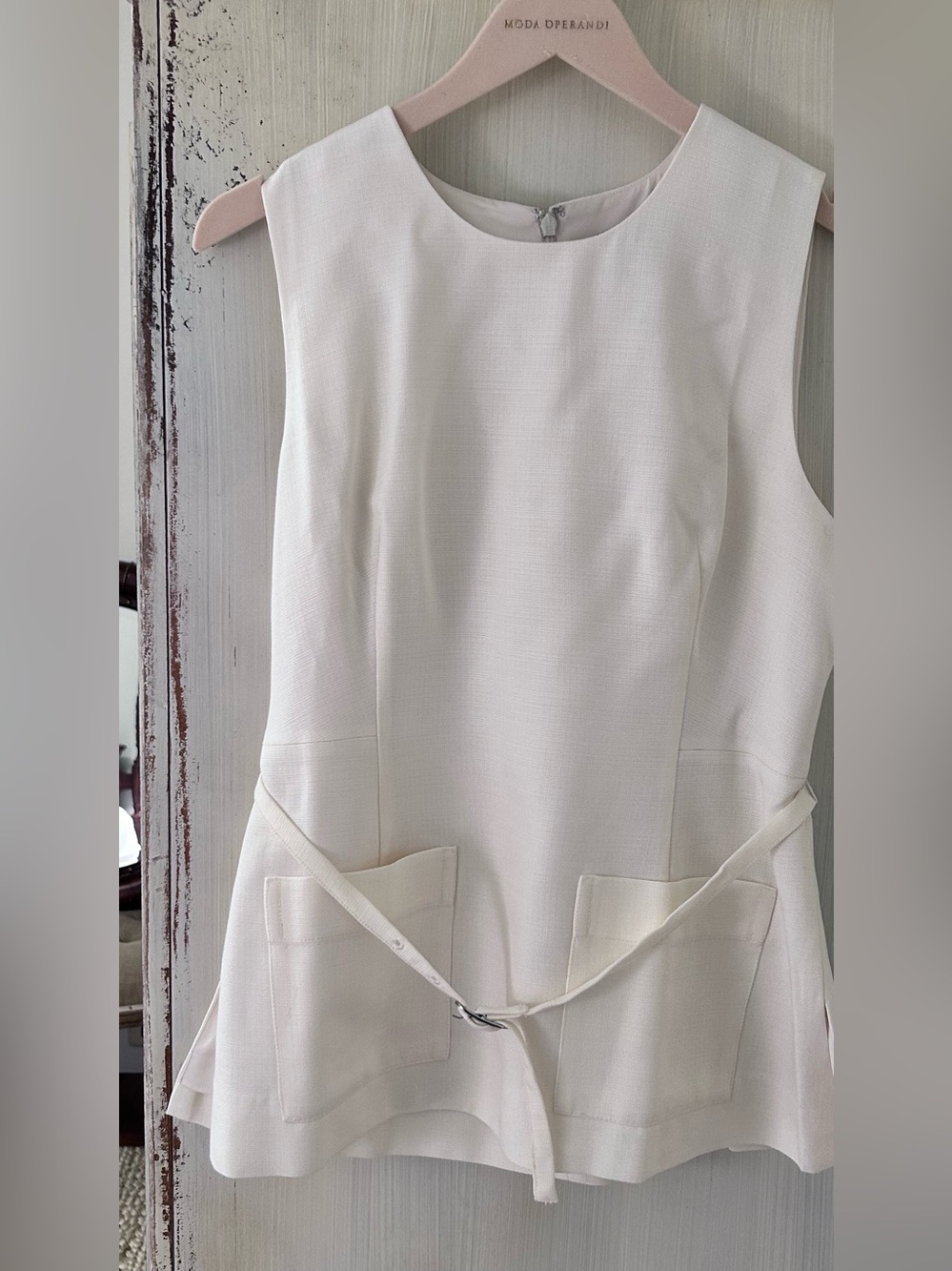 Off white, linen look,  sleeveless J Crew top, fitted at waist with narrow belt